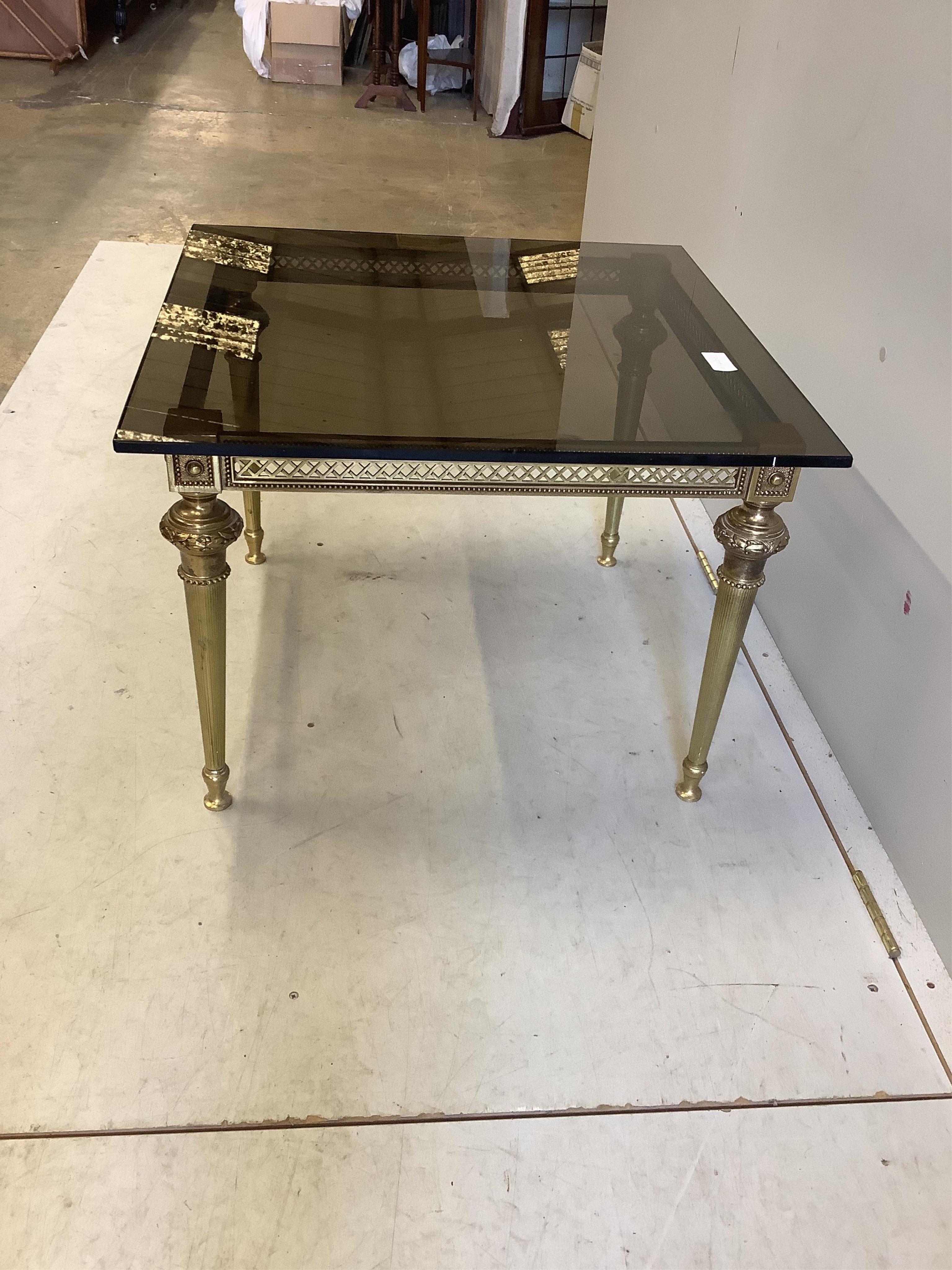 A rectangular gilt metal smoked glass occasional table, width 65cm, depth 65cm, height 46cm. Condition - good